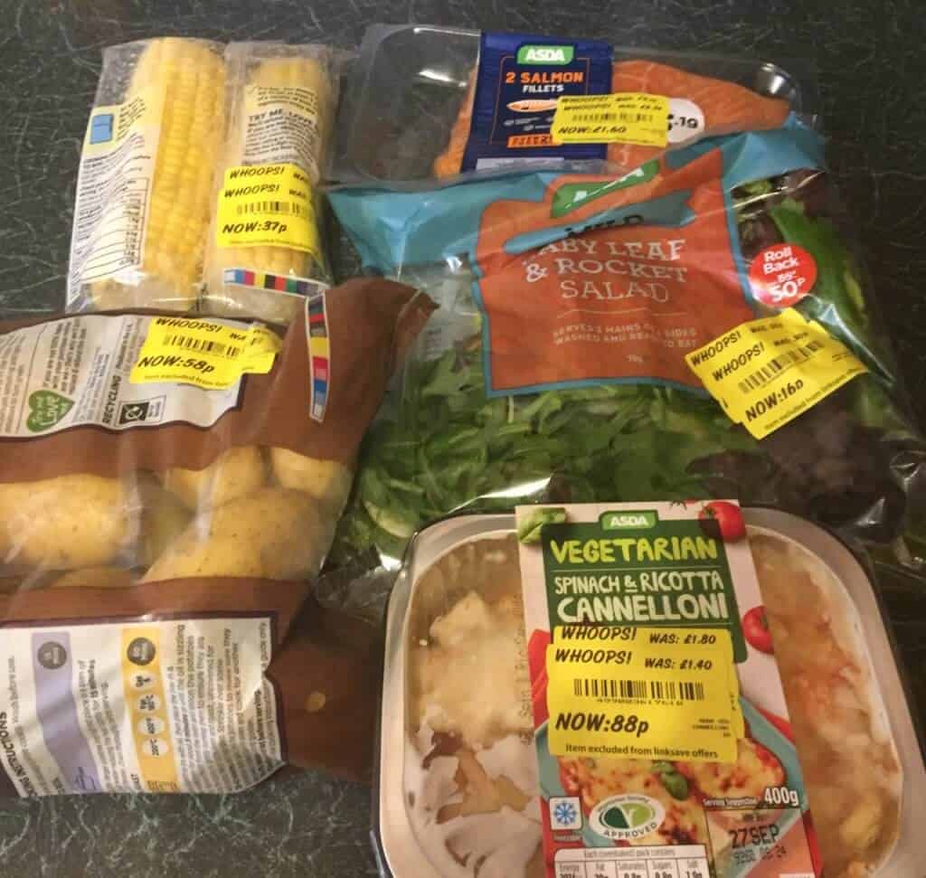 Sweetcorn, potatoes, rocket salad, canneloni and salmon fillets all still packaged with yellow price redution stickers