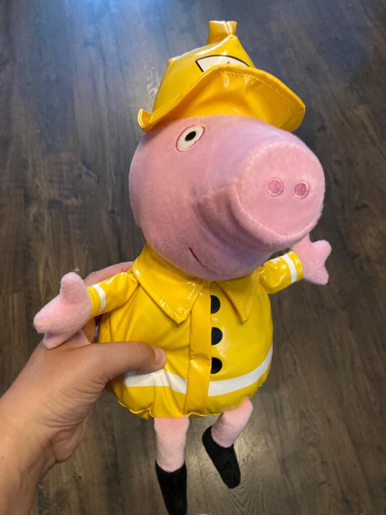 Peppa Pig wearing teddy a yellow waterproof hat and coat
