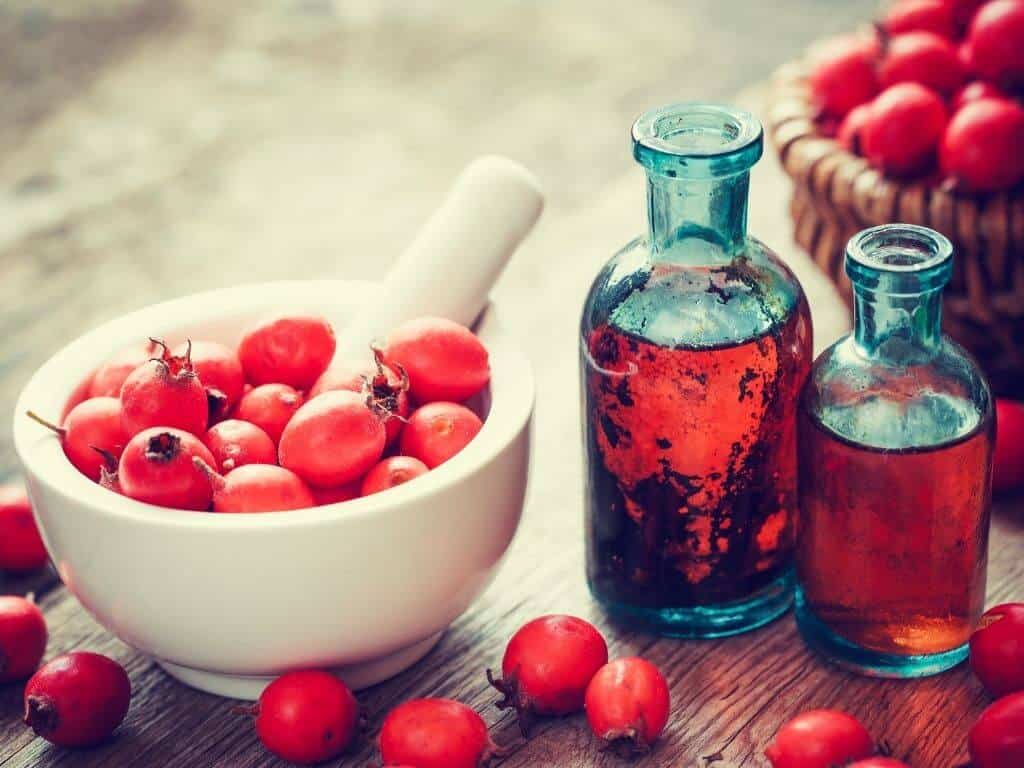 Hawthorn berries in a pestle and mortar